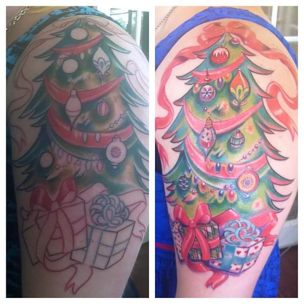 #Christmas #Tattoos Brilliant and colorful tattoo design on the side arm