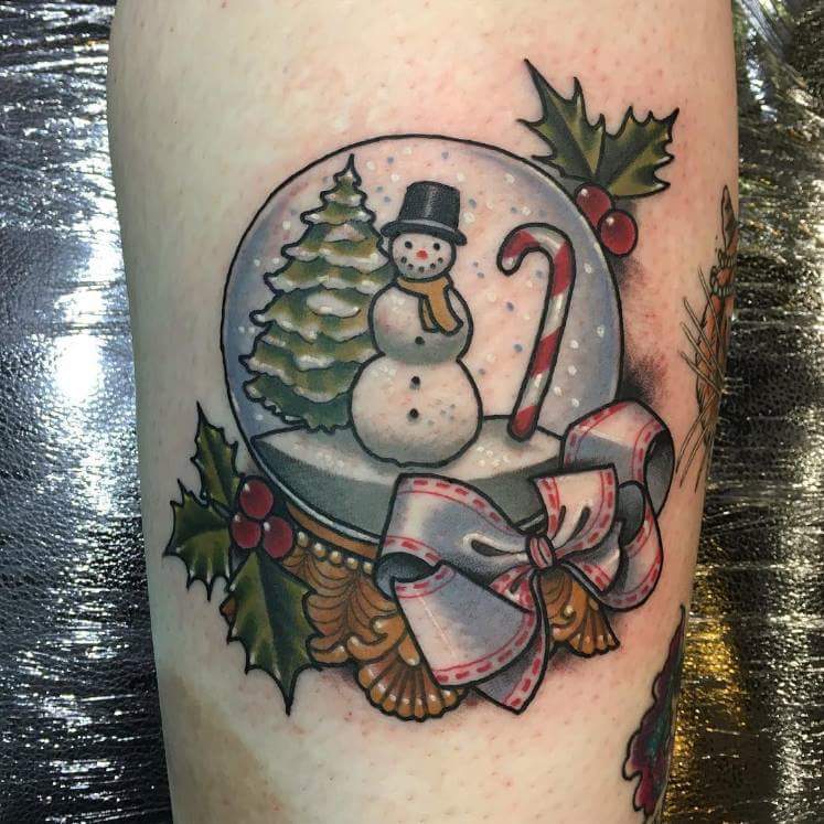 #Christmas #Tattoos Engrossingly designed tattoo on the leg for vibrant look