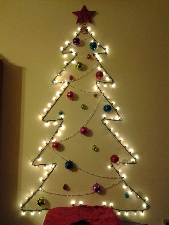 Alternative Christmas tree made by lights and decorated with ornaments.