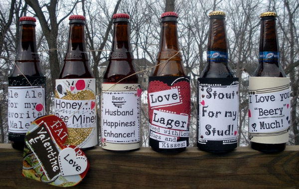 Beer bottles attached with custom love labels.