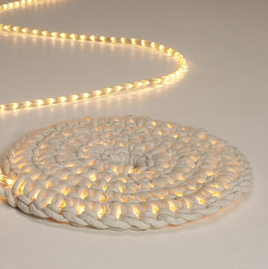 Cool light carpet by crocheting a strand of lights within a rug.