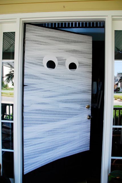 Cover your front door using good ole fashioned crepe paper streamers.