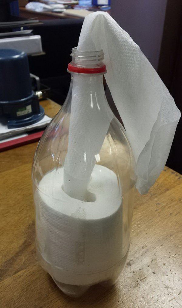 Create a toilet paper roll dispenser with used Coke bottle.