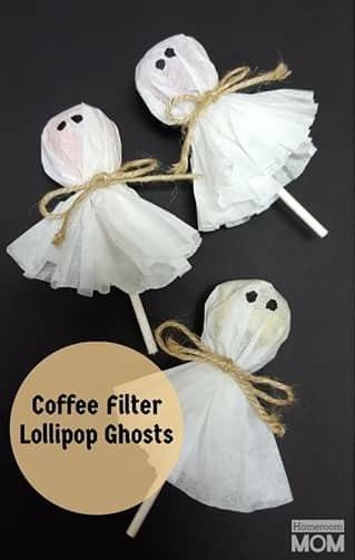 Cute ghost lollipops by coffee filters.