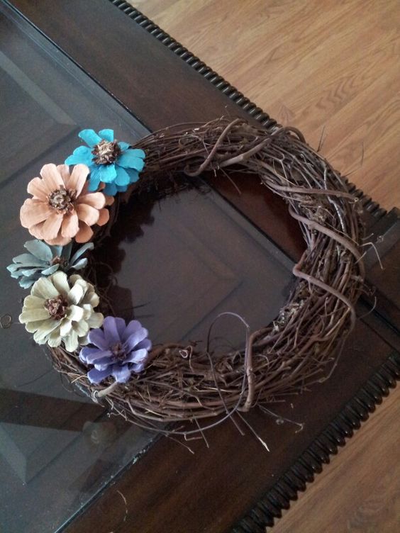 Fabulous painted pinecone flowers on a grapevine wreath.