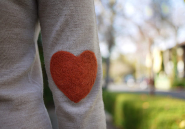 Heart patch sweater on elbow.