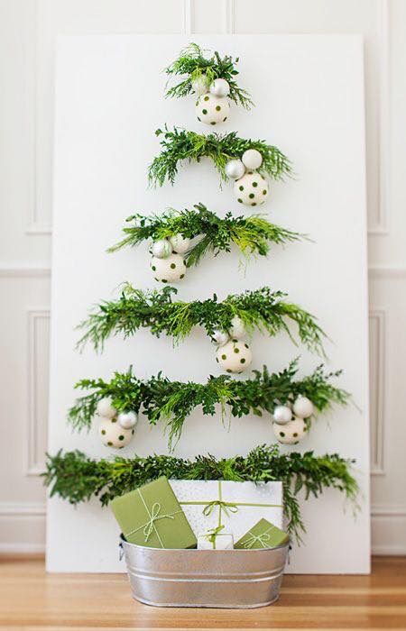 Impressive Christmas wall tree decorated with polka dots ornaments and gifts.