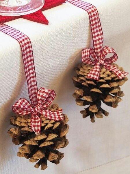 Natural pinecone hanged with plaided ribbon.
