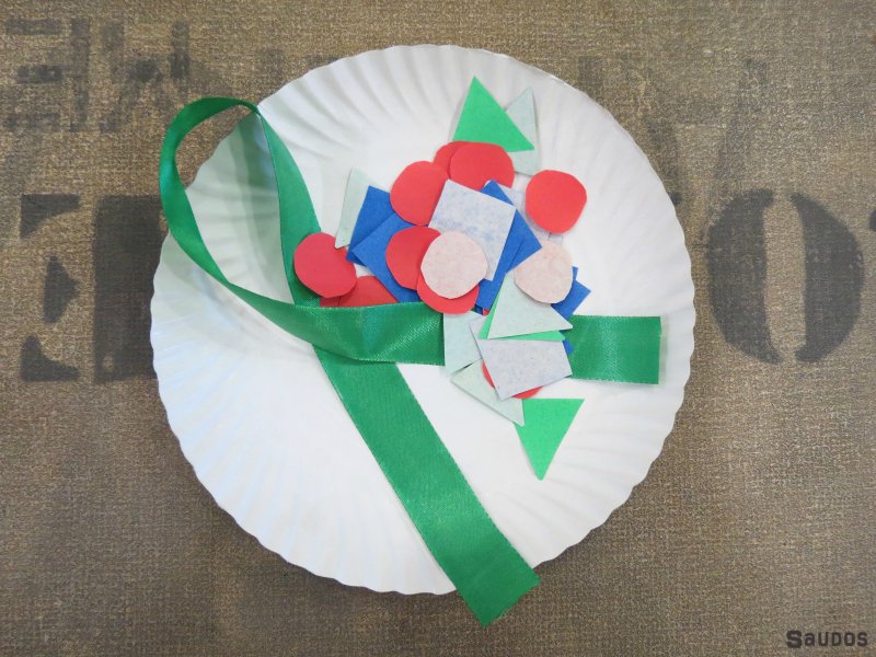 Paper plate, origami paper cut out and ribbon.