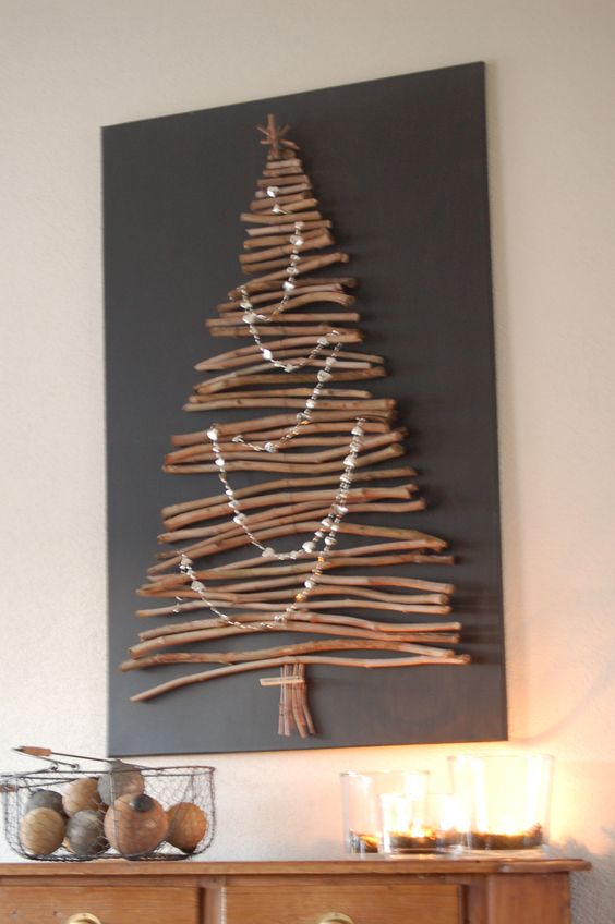 Pretty wall tree of sticks decorated with beads.