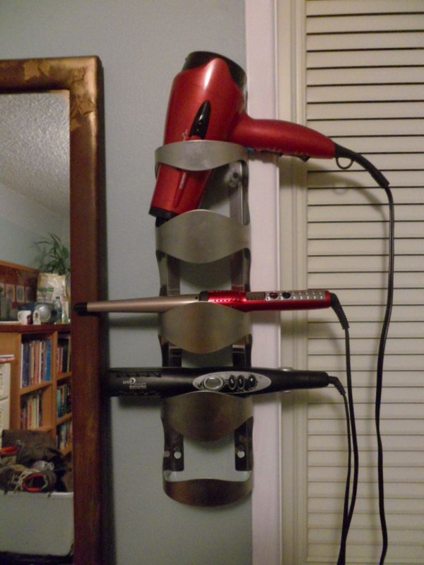 Turn your old wine bottle holder into a useful hot tools storage.