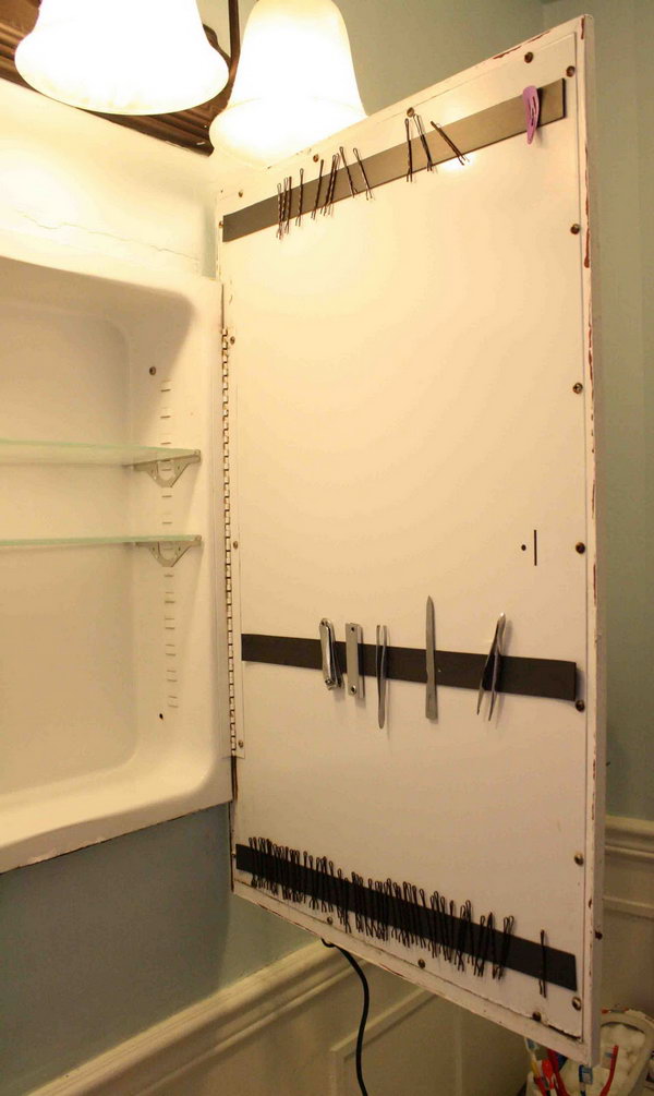 Use a magnetic strip to store bobby pins behind a cabinet door..