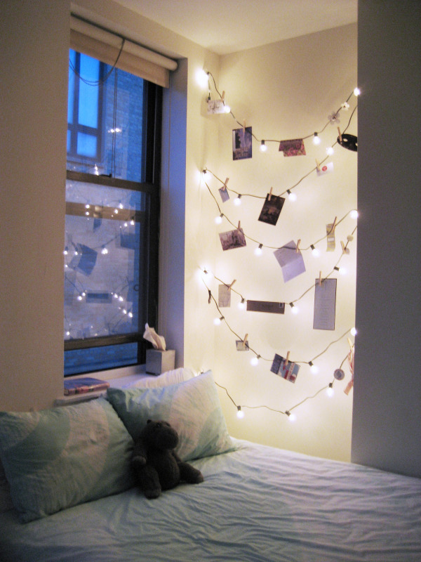 Use string lights with clothespins to hang photographs.