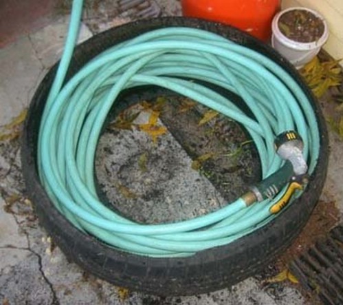 Make a Hose Caddy Out of an Old Tire.