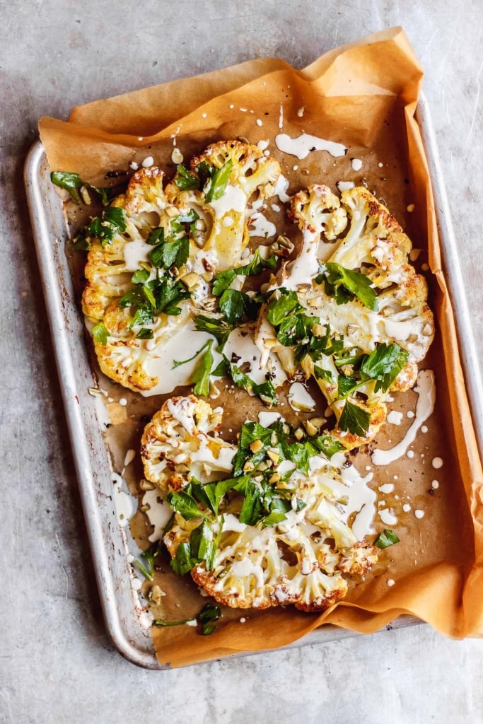 HERBED CAULIFLOWER STEAKS WITH EVERYDAY LEMON TAHINI DRESSING BY WITH FOOD & LOVE