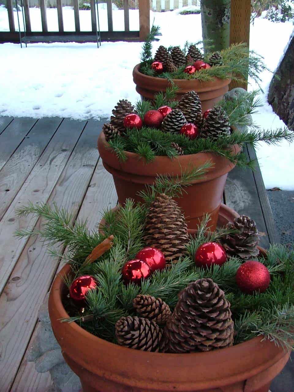 Pots filled with Christmas decor.