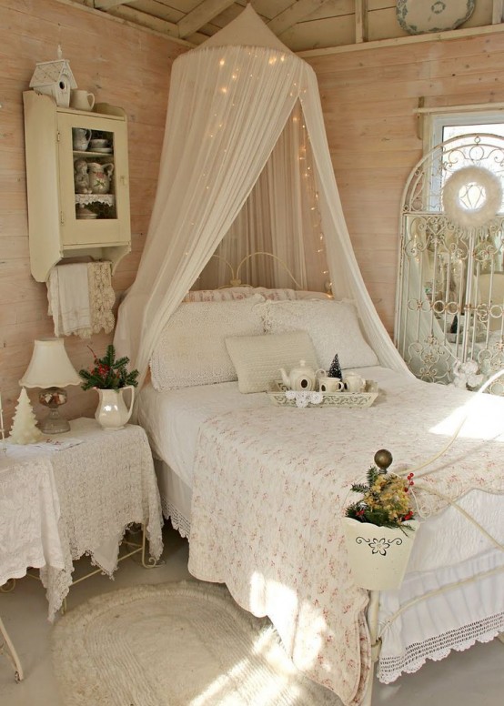 Sweet shabby chic bedroom with a canopy bed.
