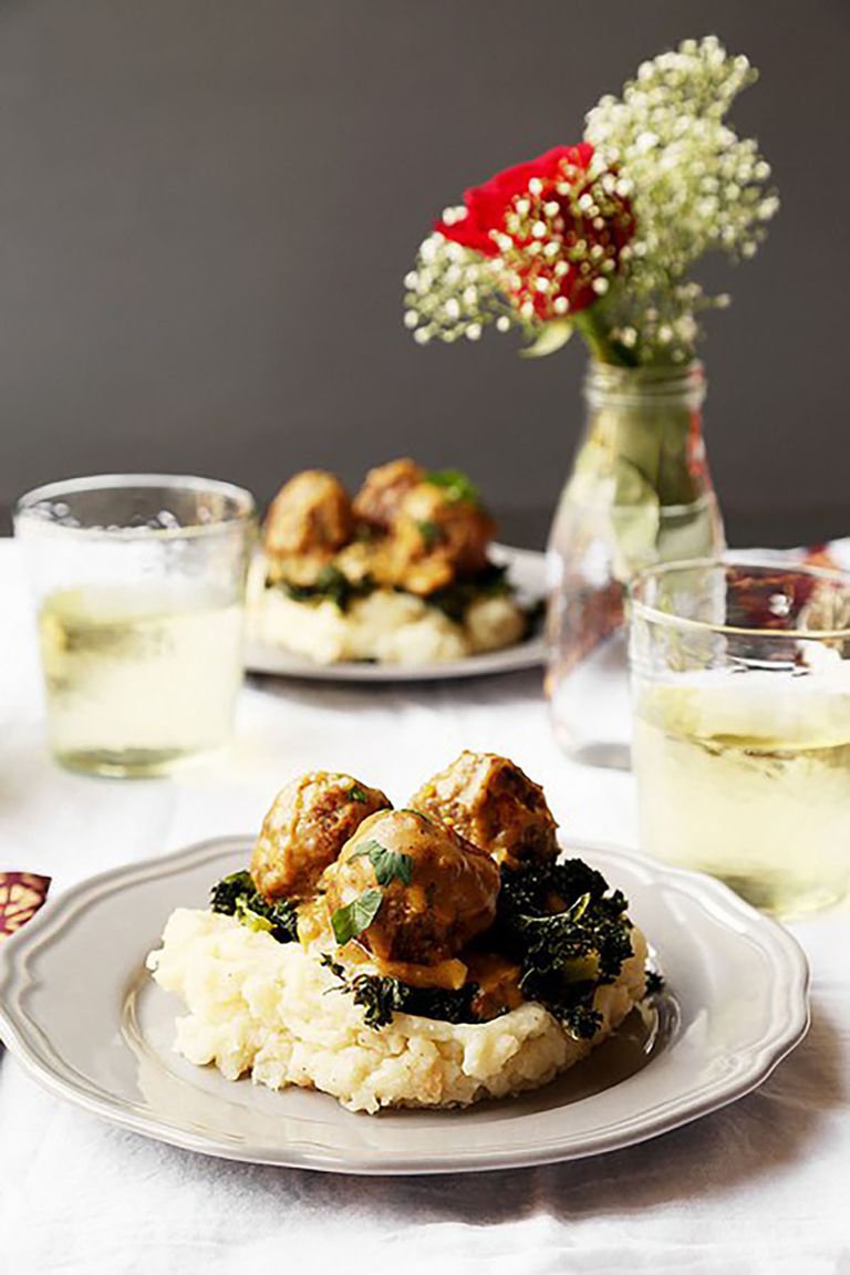 Braised Meatballs with Roasted Garlic Mashed Potatoes and Kale.