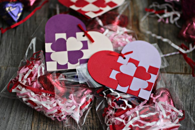 DIY heart-shaped woven gift tags in purple and red.