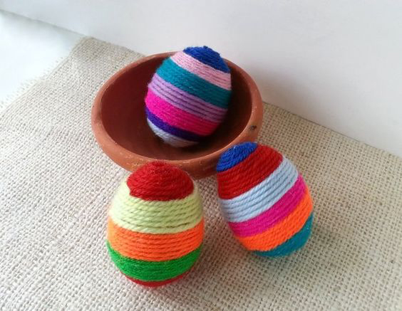 Colorful yarn wrapped eggs from Craftbits
