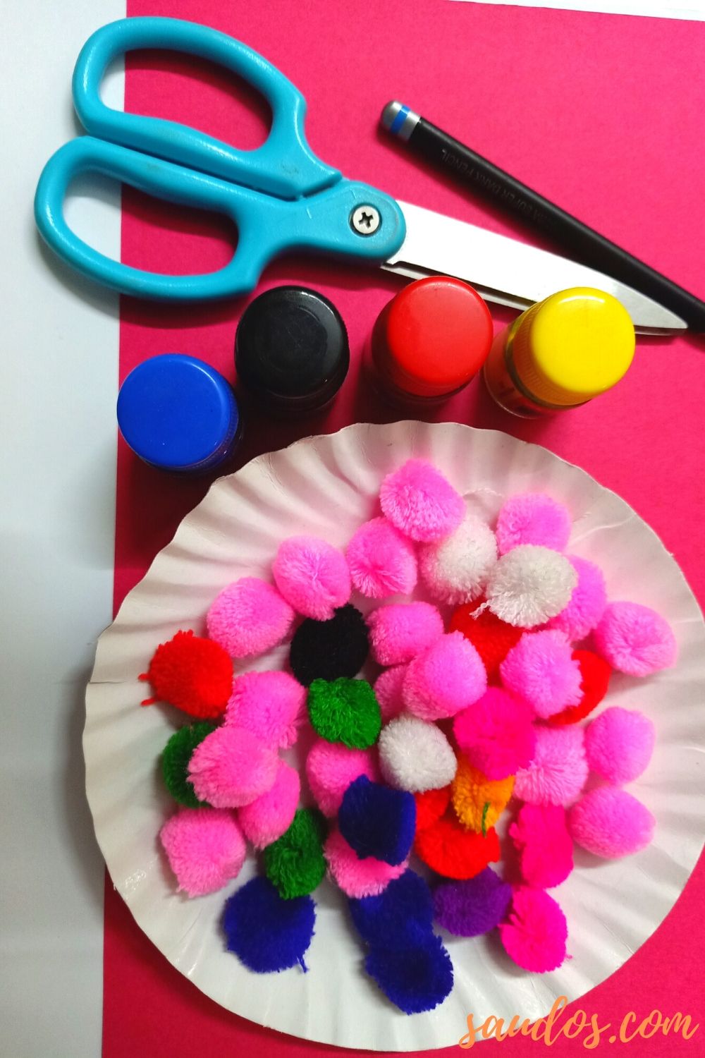 Supplies needed to make Easter eggs using pompoms